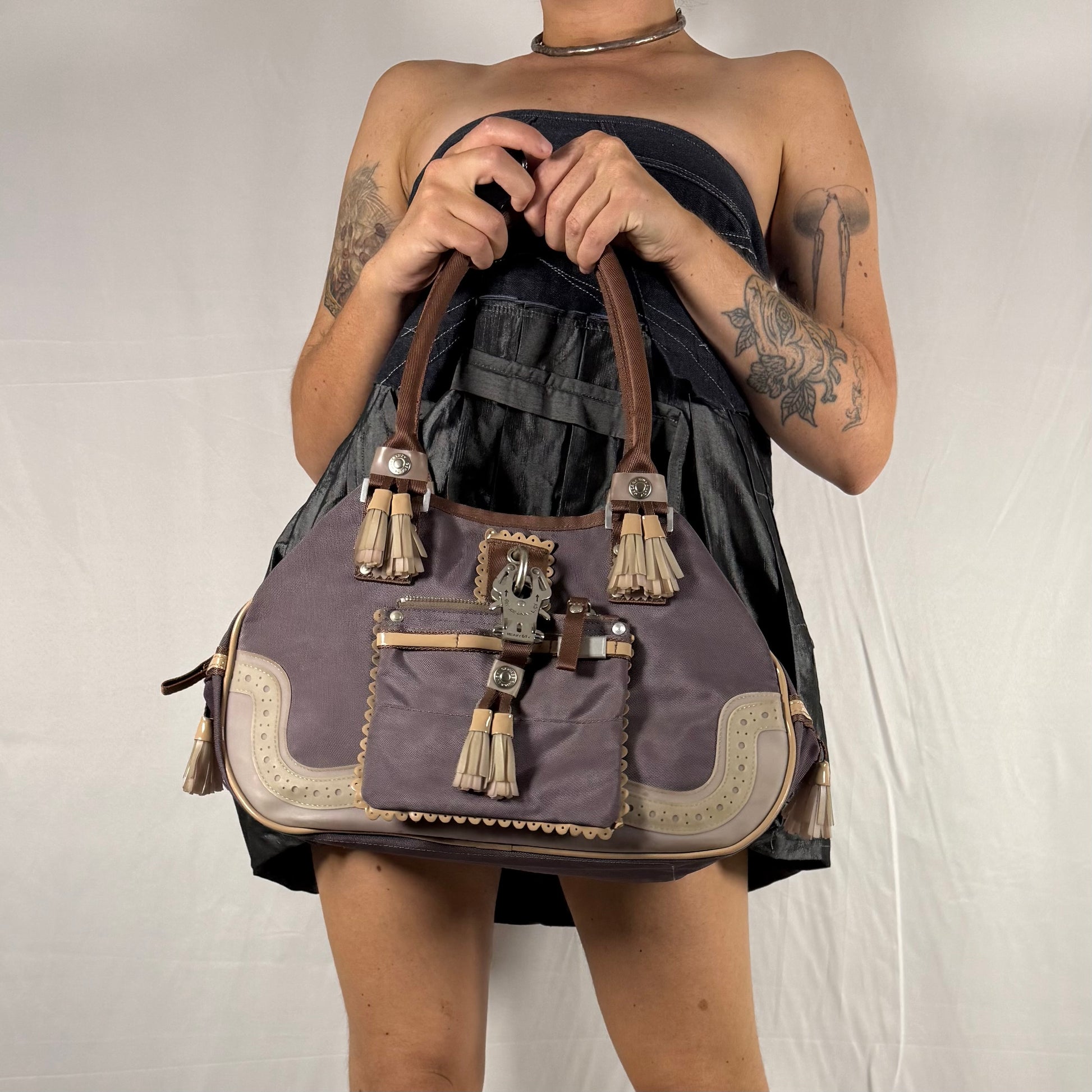 Y2K George Gina & Lucy purple shoulder bag with oversized carabiner clip and tassel detail