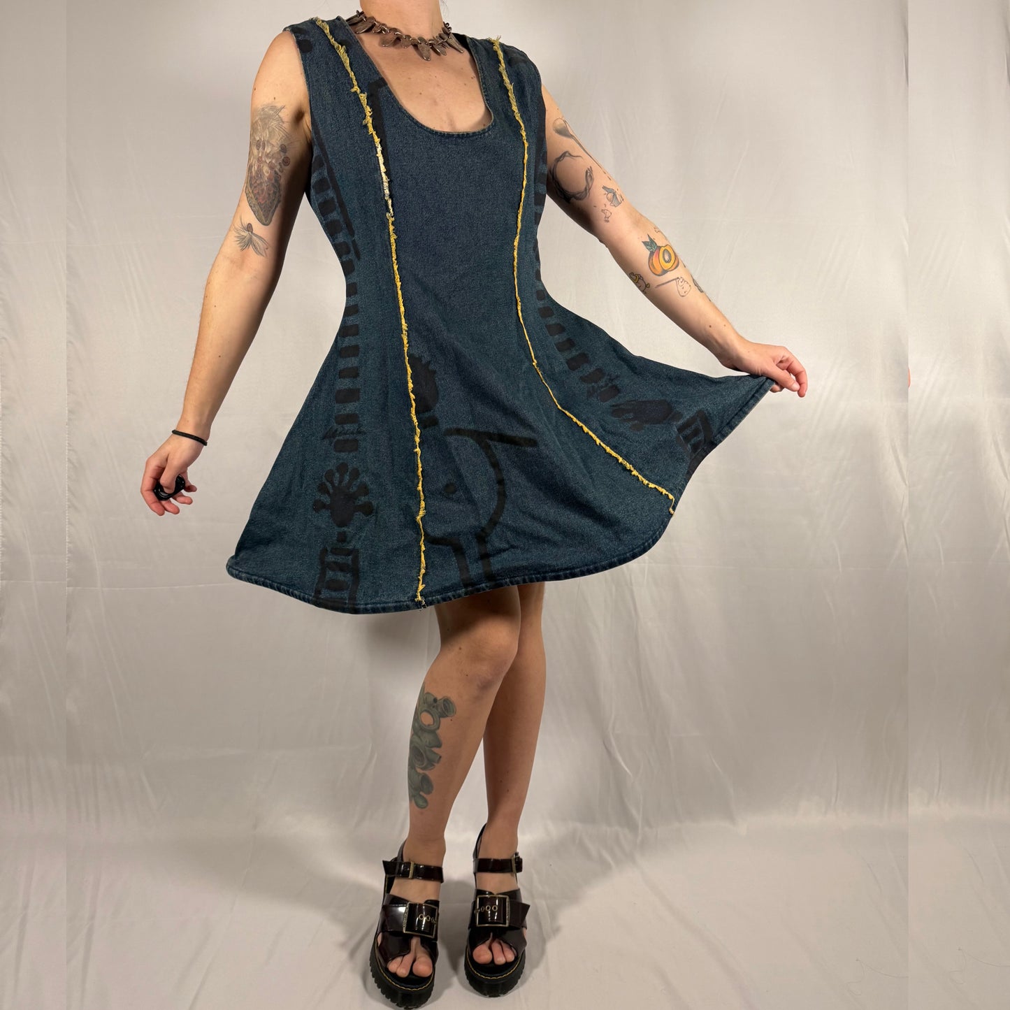 Y2K vintage Biche de Bère denim dress with structured hoop skirt, flared silhouette, abstract print, and exposed seam detailing