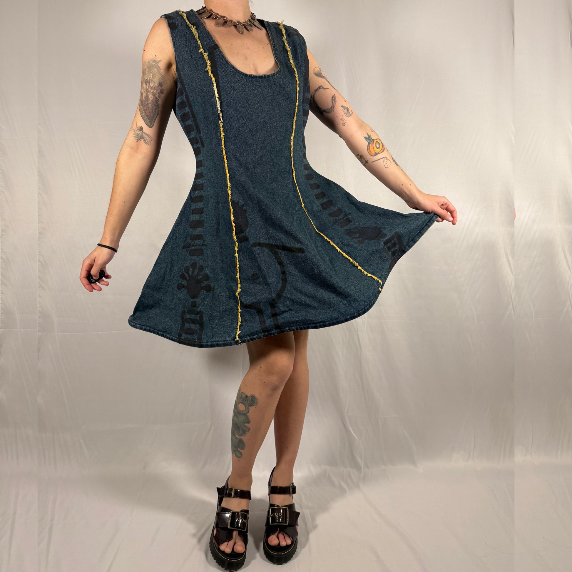 Y2K vintage Biche de Bère denim dress with structured hoop skirt, flared silhouette, abstract print, and exposed seam detailing