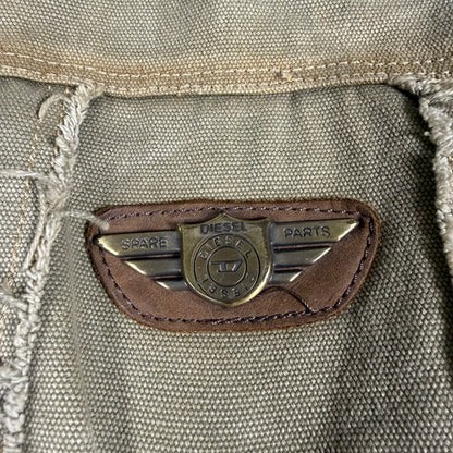 Close-up of a Diesel logo on a textured fabric surface