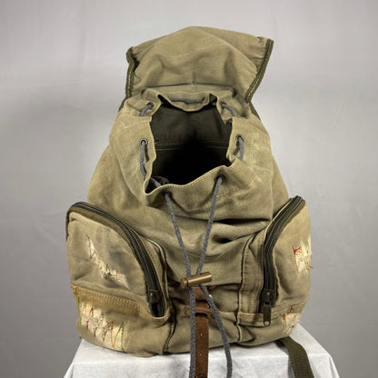 Vintage-style backpack with a hood on a gray background