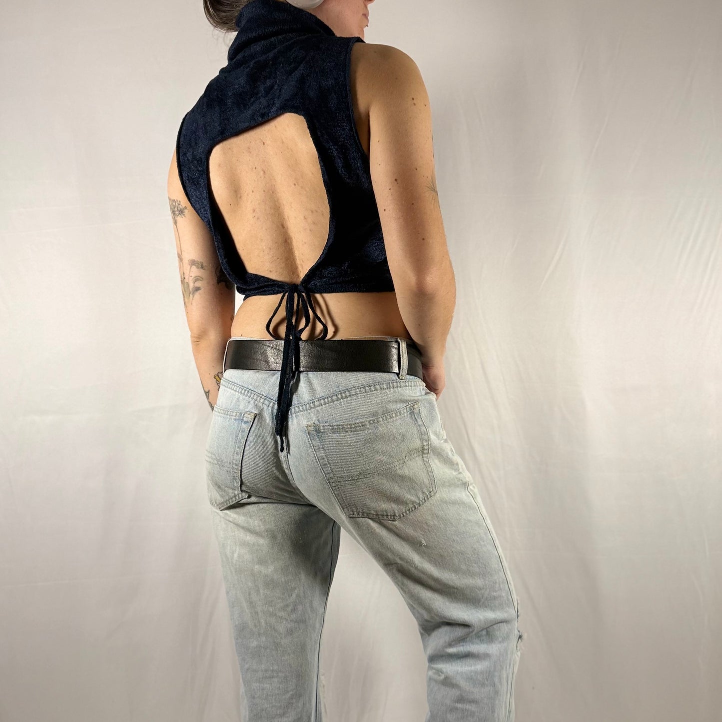 Back view of vintage Sarah Pacini Y2K midnight blue open-back knit top featuring dramatic cutout and adjustable tie closure.