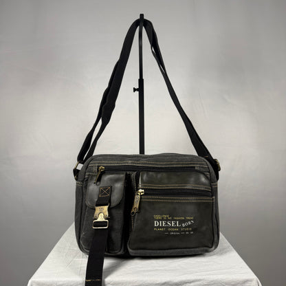 Vintage Y2K Diesel black canvas messenger bag with leather trim, utility pockets, adjustable shoulder strap, and brass hardware.
