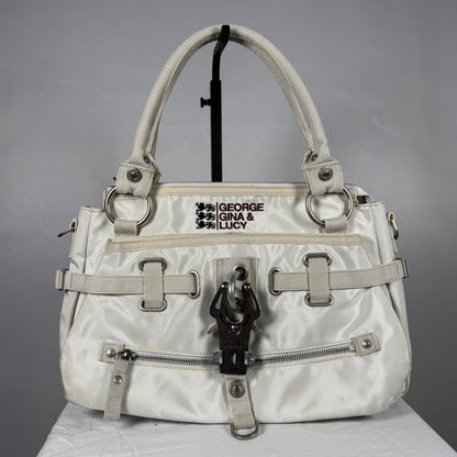 Vintage 2008 George Gina & Lucy Jelly Bean white shoulder bag with oversized metal hardware, multiple zip pockets, embroidered branding and adjustable strap details.